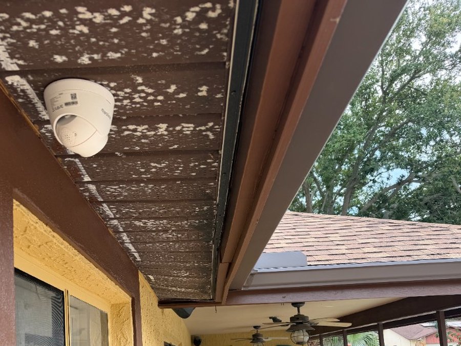 Outdoor smart camera mounted under patio soffit